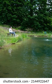 A vertical shot of Businessman Enjoying Fishing