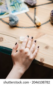 A Vertical Shot Of Caucasian Female Hand On The Table With Stones In Art Studio In The UK