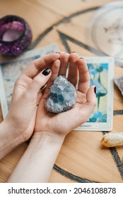 A Vertical Shot Of Caucasian Female Hands Holding A Piece Of Mineral In Art Studio In The UK