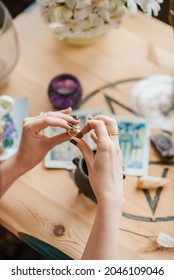 A Vertical Shot Of Caucasian Female Hands Holding A Piece Of Mineral In Art Studio In The UK