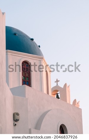 A vertical shot of a church in Santorini - one of the Cyclades islands in Greece