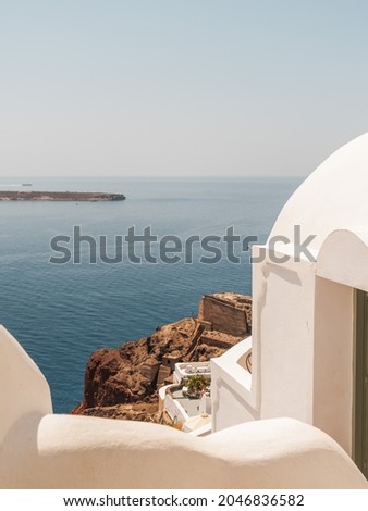 A vertical shot of the coastal buildings of Santorini in Greece