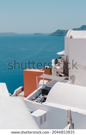 A vertical shot of the coastal buildings of Santorini in Greece
