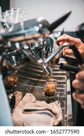 A vertical shot of a coffee-making process with coffee machine