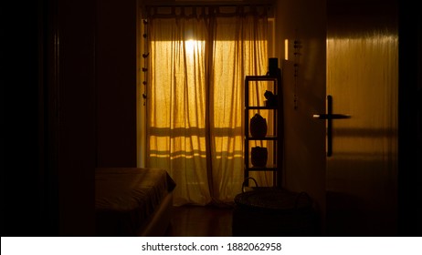 A vertical shot of a cozy room with a retro design and closed windows at the sunset time - Shutterstock ID 1882062958