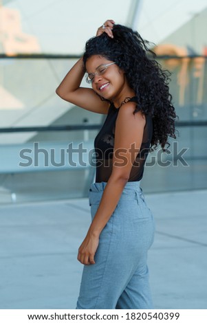 Similar – Happy mixed woman with afro hair laughing outdoors