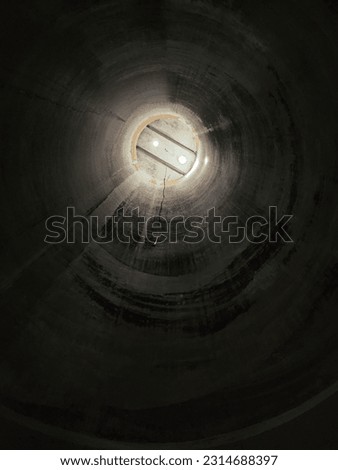 A vertical shot of an empty grain silo