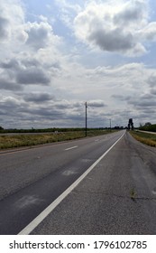 A vertical shot of an empty road during daytime