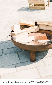 A vertical shot of a fire place preparation outdoors for a party