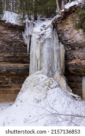 A Vertical Shot Of A Frozen Waterfall In Winter In Upper Peninsula, Michigan, USA, Lake Superior, Great Lakes