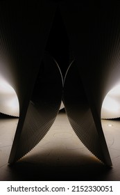 A Vertical Shot Of Futuristic Parametric Architecture In A Dark Room With Less Lights