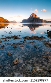 A vertical shot of gorgeous sea landscapes with reflections and rocks in El Nido, Palawa, Philippines