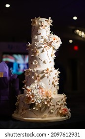 A Vertical Shot Of A Gourmet Wedding Cake In A Country Club In New Jersey