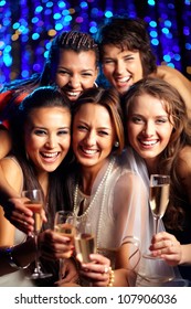 Vertical Shot Of Group Of Young Women Having Fun At Wedding Party