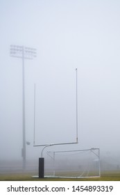 Vertical Shot Of High School Football Field On A Foggy Morning