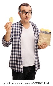 Vertical Shot Of A Joyful Young Man Eating Potato Chips Isolated On White Background