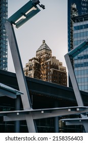 A Vertical Shot Of The Marine Building In Vancouver Through Metal Constructions