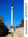 A vertical shot of a memorial statue in Alton Cemetery in Illinois