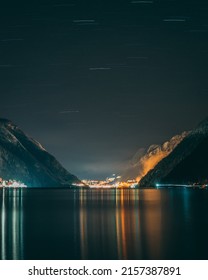 A Vertical Shot Of The Mesmerizing Beauty Of Starlight Over Odda City In Norway