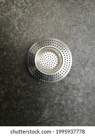 A Vertical Shot Of A Metal Sink Strainer