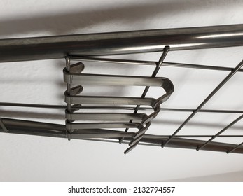 A Vertical Shot Of Metal Wardrobe Hooks