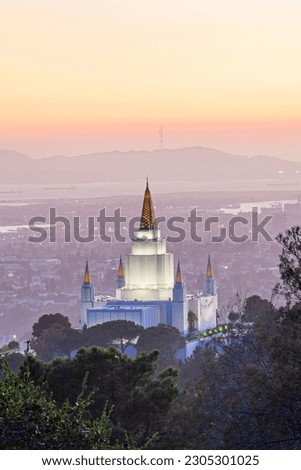 A vertical shot of the Oakland California Temple on the hills of Oakland at sunset, USA