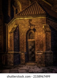 A Vertical Shot Of An Old Gothic Church At Night