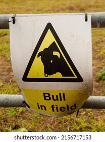 A Vertical Shot Of An Old Warning Sign 