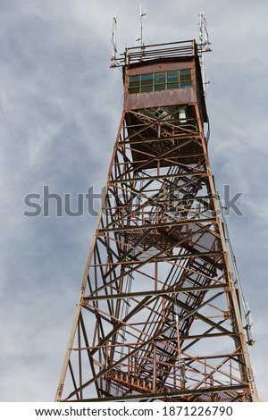 A vertical shot of the Olson Tower under a cloudy sky in West Virginia