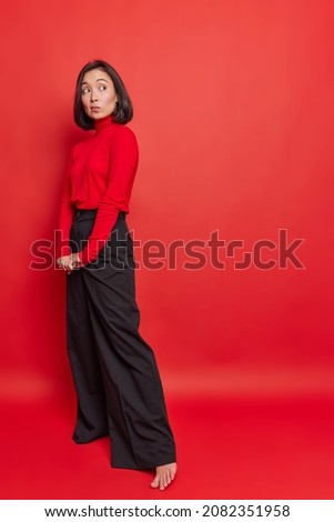 Similar – Image, Stock Photo Slim woman in black bodysuit practicing yoga near sea or ocean during sunrise light. Flexibility, stretching, fitness, healthy lifestyle.