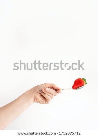 Similar – Woman holds strawberries in her hands