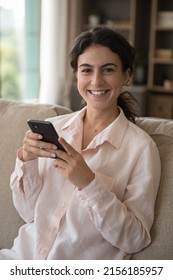 Vertical Shot Portrait Of Teenage Girl Spend Leisure At Home Using Smartphone, Have Fun On Internet, Use Mobile Applications, Young Generation And Modern Wireless Tech Usage, Habit, Connection Concept