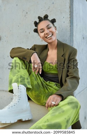 Similar – Woman with green boots walking on spinach field.