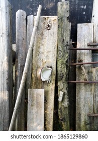 A Vertical Shot Of A Rural Warehouse With Wooden Objects