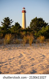 A Vertical Shot Of The Sandy Beach And Cape May Lighthouse In Lower Township, New Jersey