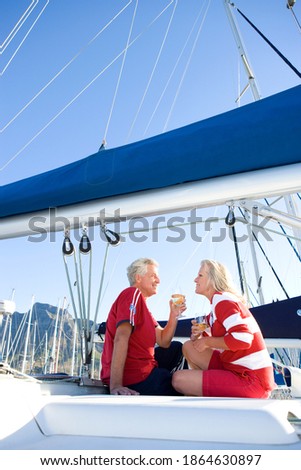 Similar – Foto Bild Yacht, die an einer Küste festgemacht ist.