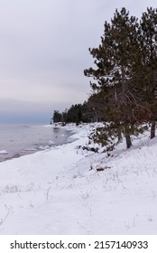 A Vertical Shot Of The Snow-covered Upper Peninsula, Michigan, USA, Lake Superior, Great Lakes In Winter