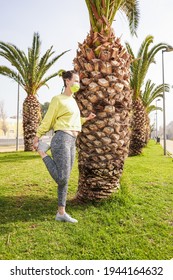 A Vertical Shot Spanish Woman Wearing A Face Mask While Exercising Outdoor - New Normal Concept