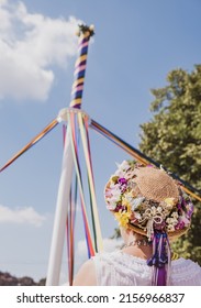 A vertical shot of a traditional English maypole dancer with a hat at Countryfile Live