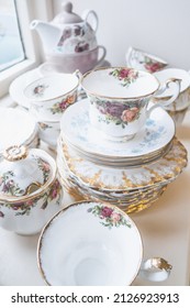 A Vertical Shot Of A Vintage English Bone China Crockery With Blurry Background