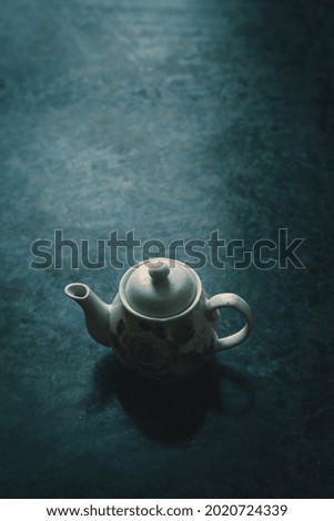 Similar – A painted ceramic milk jug next to an empty white cup