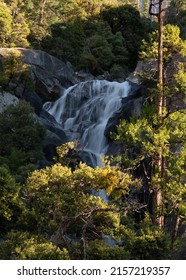 A Vertical Shot Of A Waterfall At Yosemite National Park