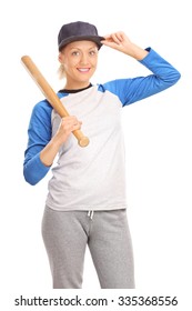 Vertical shot of a young blond woman holding a baseball bat and looking at the camera isolated on white background