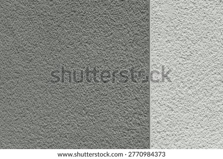 Vertical split plaster wall with contrasting gray tones