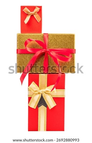 Vertical stack of elegant red and gold gift boxes decorated with satin bows and ribbons, symbolizing luxury celebration and holiday spirit, isolated on white background.