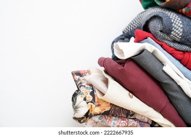 Vertical stack of fabrics on a white background