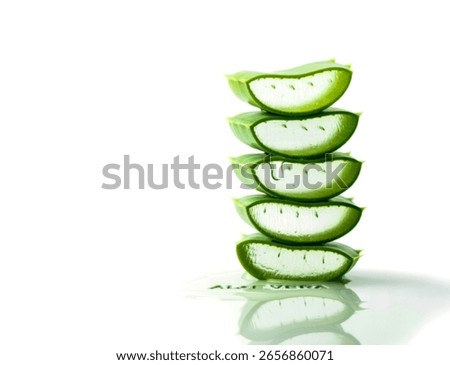 A vertical stack of five fresh aloe vera slices, showcasing their translucent gel. A single drop of gel drips from the second slice, with the words 