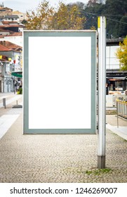 Vertical Street Poster Advertisement Mockup On A Cobbled Street. Iron Pole. Copy Space.