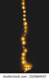 vertical string of lights in the dark - Shutterstock ID 2105869547