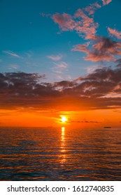 Vertical sunset scenery of beautiful Indian ocean amazing colorful cloudy sky and sea, Amazing nature seascape background image